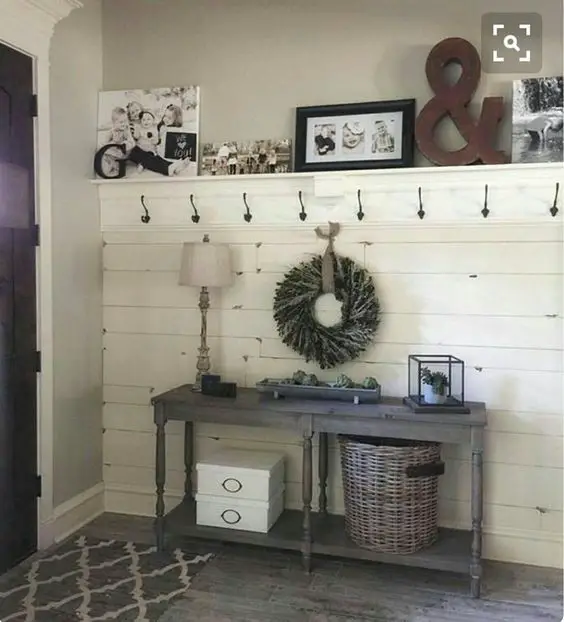 I am in LOVE with this mudroom idea!  I need some more baskets to really organize and keep all the STUFF in our foyer organized but this is such a pretty DIY mud room idea!