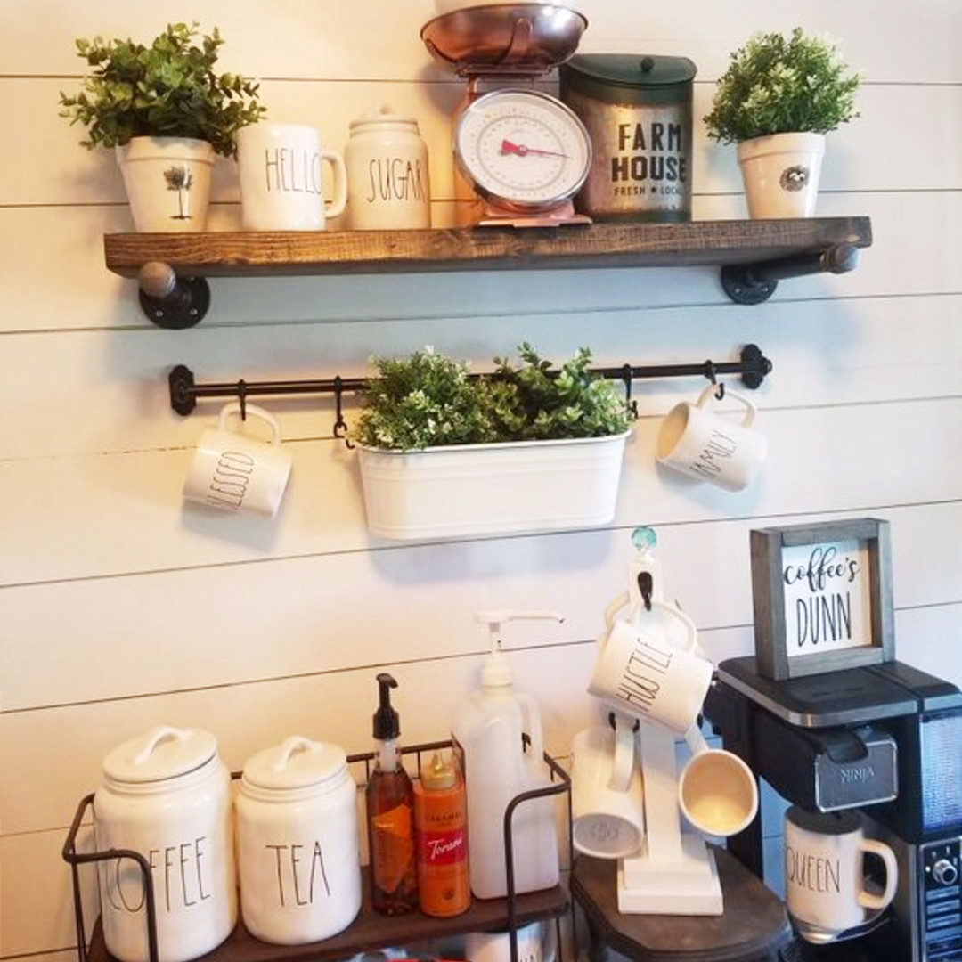 Gorgeous farmhouse coffee bar idea!  Shiplap wall, industrial pipe shelves and oh yes, the Rae Dunn coffee canisters and coffee mugs.  Beautiful!