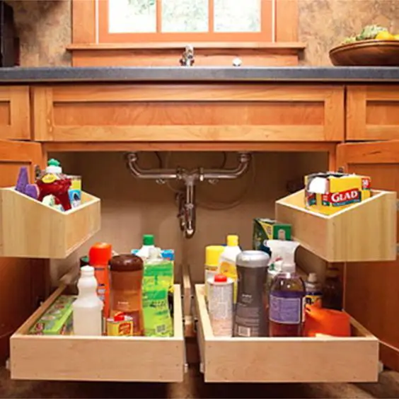 Smart way to declutter and organize under your kitchen sink - and wow, how easy it would be to find everything! #gettingorganized #organizationideasforthehome #getorganized #cleaninghacks #kitchenideas #kitchenorganization #cleaningtricks #organizedhome #diyideas #diyinspiration #organizingtips