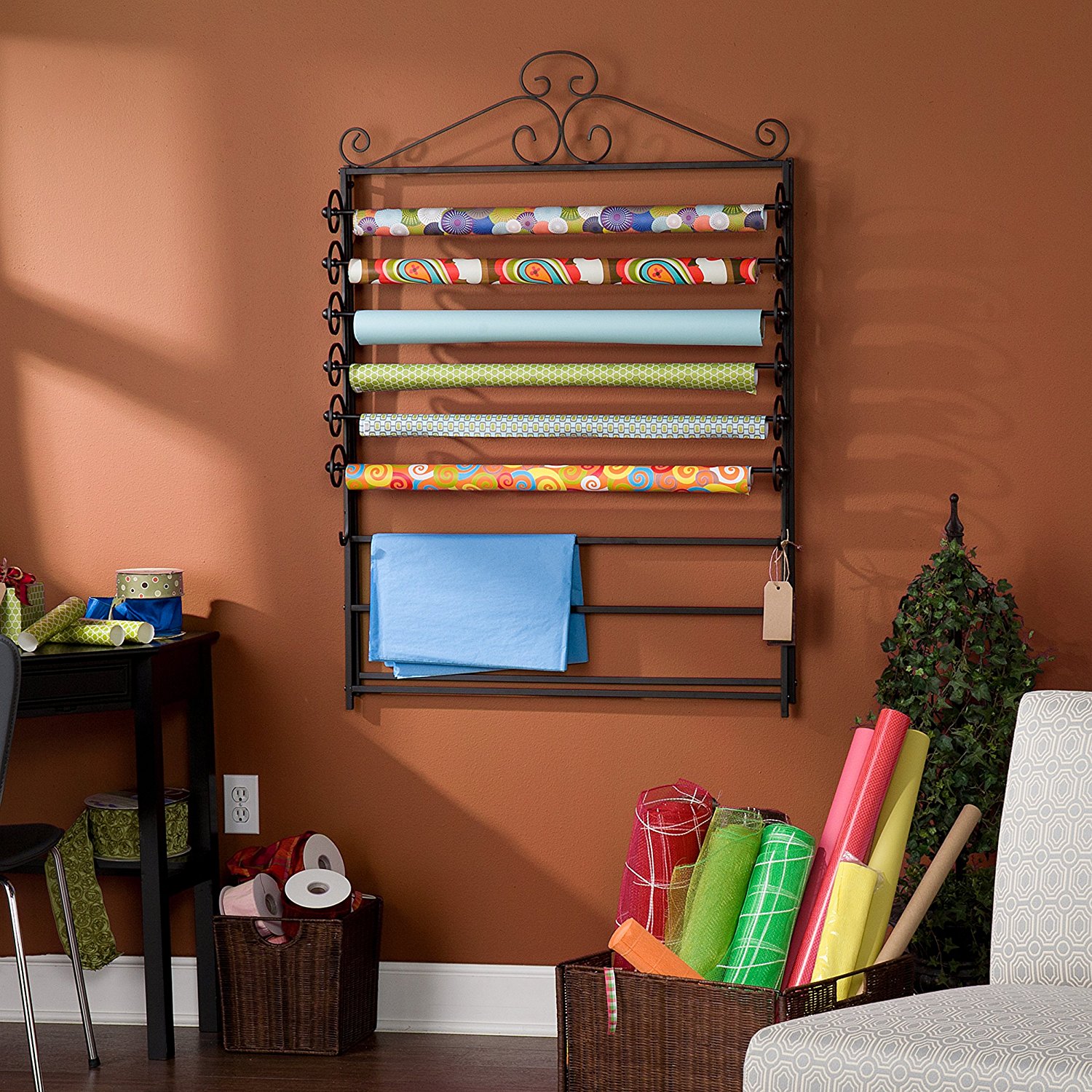 Wrapping paper organizer that hangs on the wall.  Smart idea