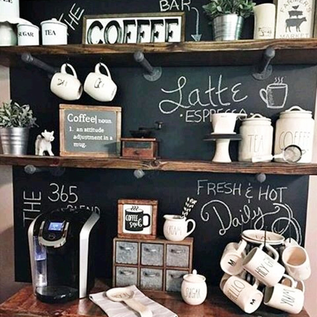 Creative DIY coffee bar idea!  Love the chalkboard wall behind this small kitchen coffee station - the industrial pipe shelving is gorgeous too