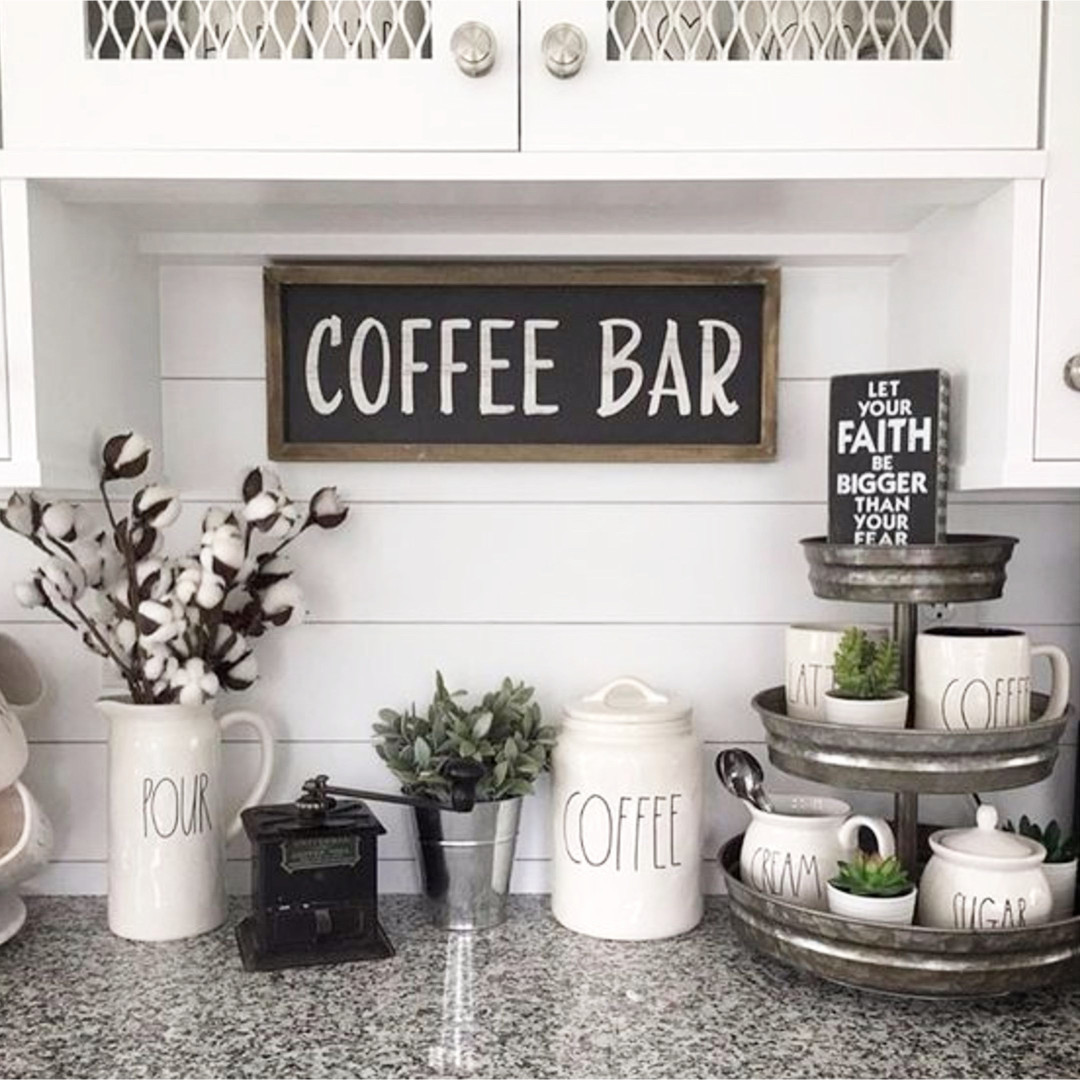 Beautiful coffee bar set up ideas on this kitchen counter.  Love the Rae Dunn coffee mugs and canisters and that 3-tier organizer is a great touch