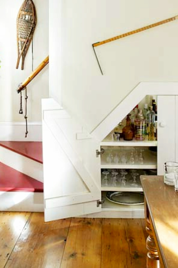 Under stair storage ideas - small storage cubby under stairs for wine glasses and other kitchen storage needs