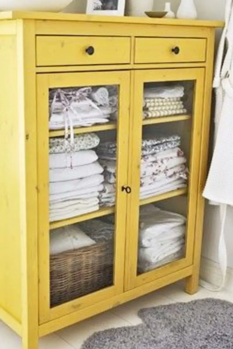 stand alone linen storage cabinet painted yellow