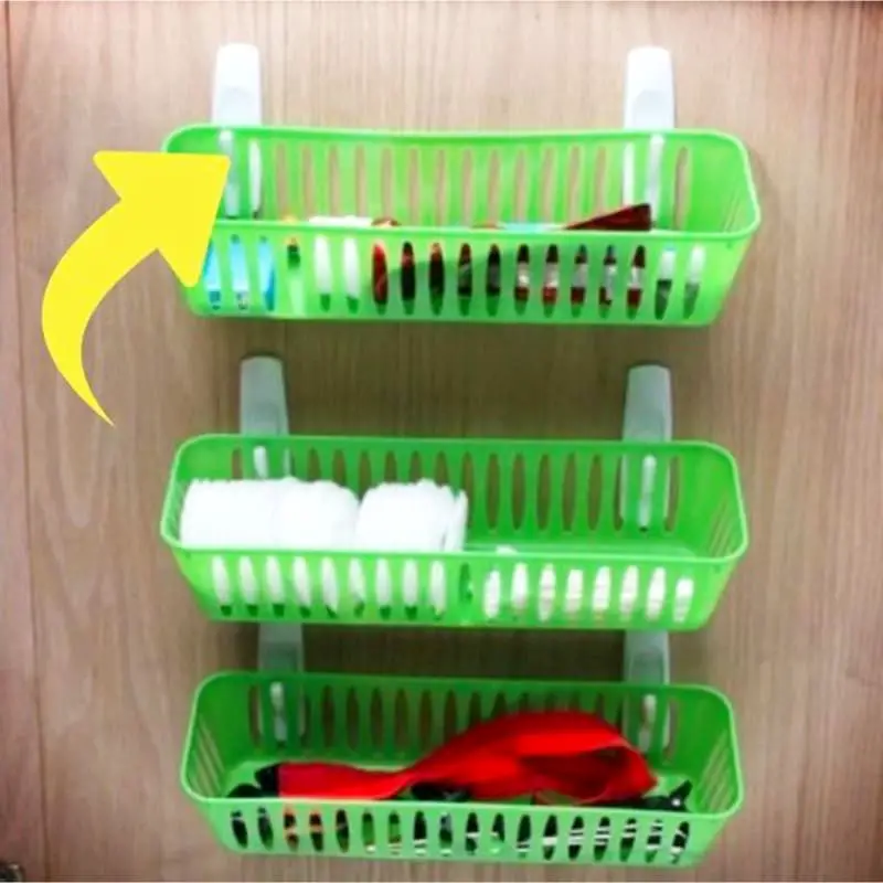 Small space DIY bathroom storage ideas to maximize storage space on a budget - cheap space saving idea using dollar tree hooks and baskets inside cabinet door